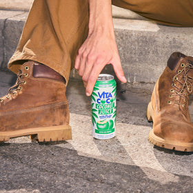 Vita Coco ice-filled glass presentation highlights cool, fruity coconut flavor.