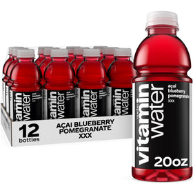 Vitaminwater XXX bottle pour showing refreshing açai-blueberry-pomegranate flavor for on-the-go hydration