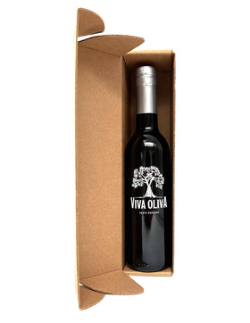 Pouring Viva Oliva Cranberry Pear White Balsamic over a salad variety