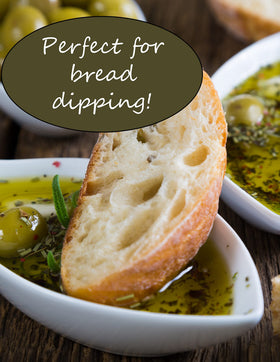 Viva Oliva Tuscan Herb Oil being poured onto bread