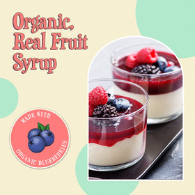 Wäbry Blueberry Syrup as a topping on ice cream creates vibrant swirls.