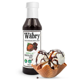 Wäbry Chocolate Hazelnut Syrup pouring over pancakes for a glossy finish.
