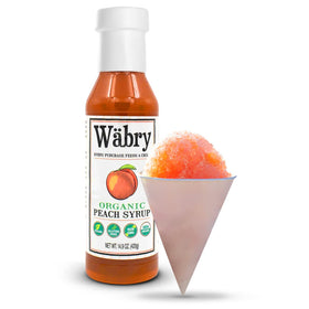 Close-up of Wäbry Peach Syrup label highlighting organic and vegan credentials