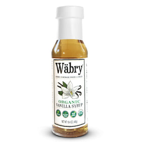 Wäbry Vanilla Syrup bottle on a kitchen counter for coffee and desserts.