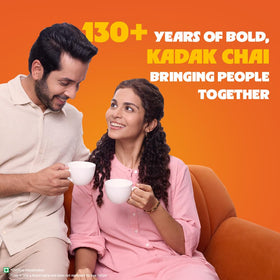 Wagh Bakri leaves steeping in a jar for a bold brew