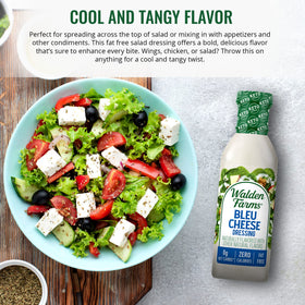 Two Walden Farms Bleu Cheese Dressing bottles with a Cobb salad.