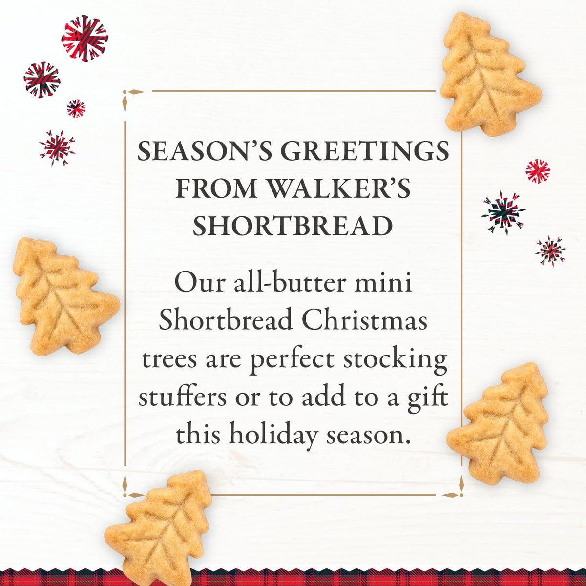 Walker's Christmas tree-shaped cookies close-up, buttery texture ideal with tea or cocoa.
