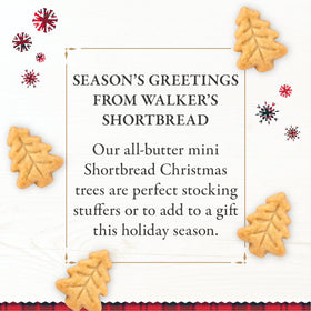 Walker's Christmas tree-shaped cookies close-up, buttery texture ideal with tea or cocoa.