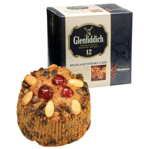 Walker’s Highland Whisky Cake slice on plate showing moist fruit and spice.