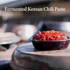 Wang Gochujang packaging back shows ingredients and non-GMO commitment.