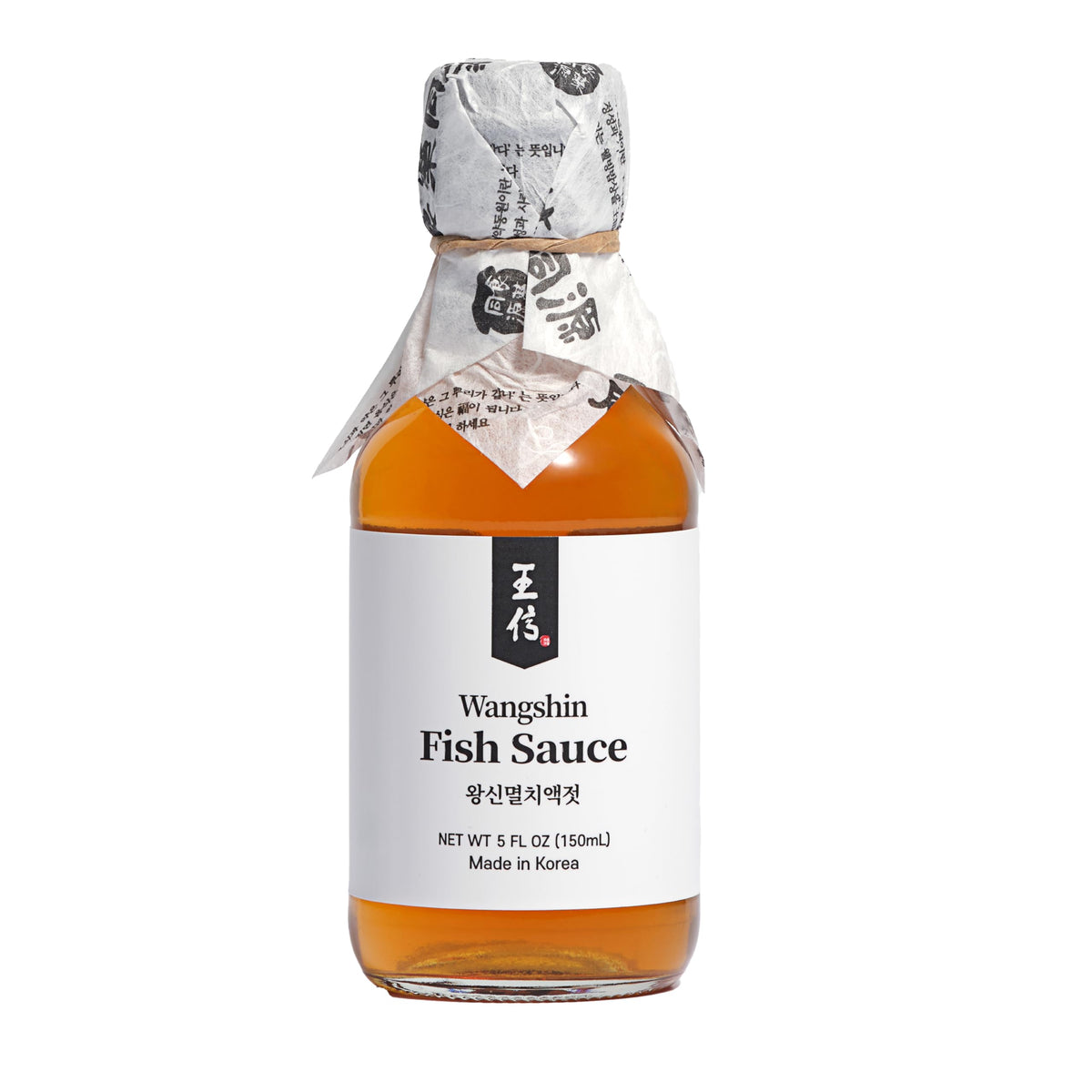 WangShin Fish Sauce bottle 5oz on kitchen counter, ideal for rich umami in meals.
