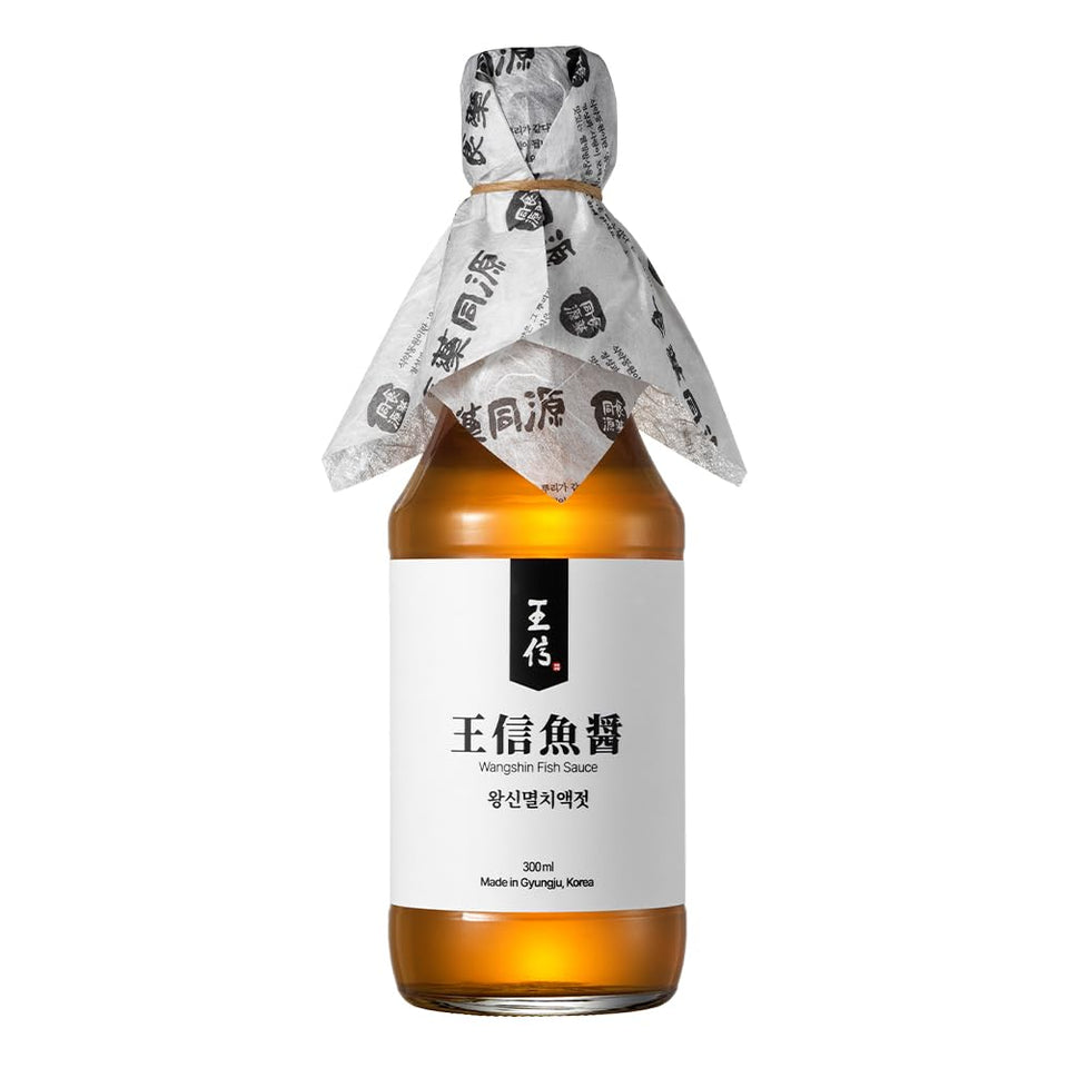 WangShin Fish Sauce bottle pour highlights rich umami for soups and marinades.