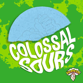 Warheads Colossal Sours crunchy texture close-up emphasizes giant candy bite.