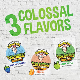 Warheads Colossal Sours orange bag — tangy bite for bulk candy buffets.
