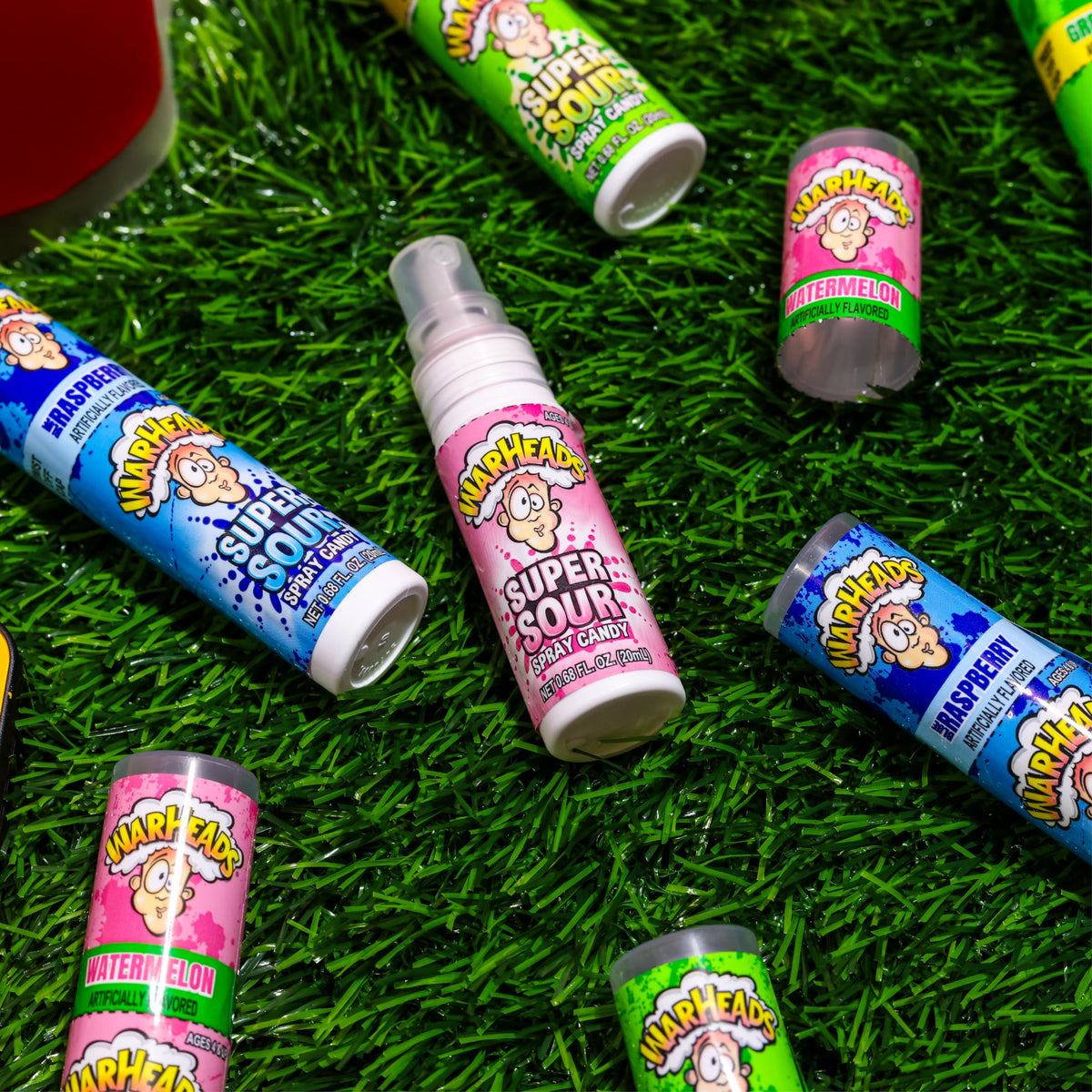 WarHeads Super Sour Spray 12-pack display shows flavors for sharing and fun