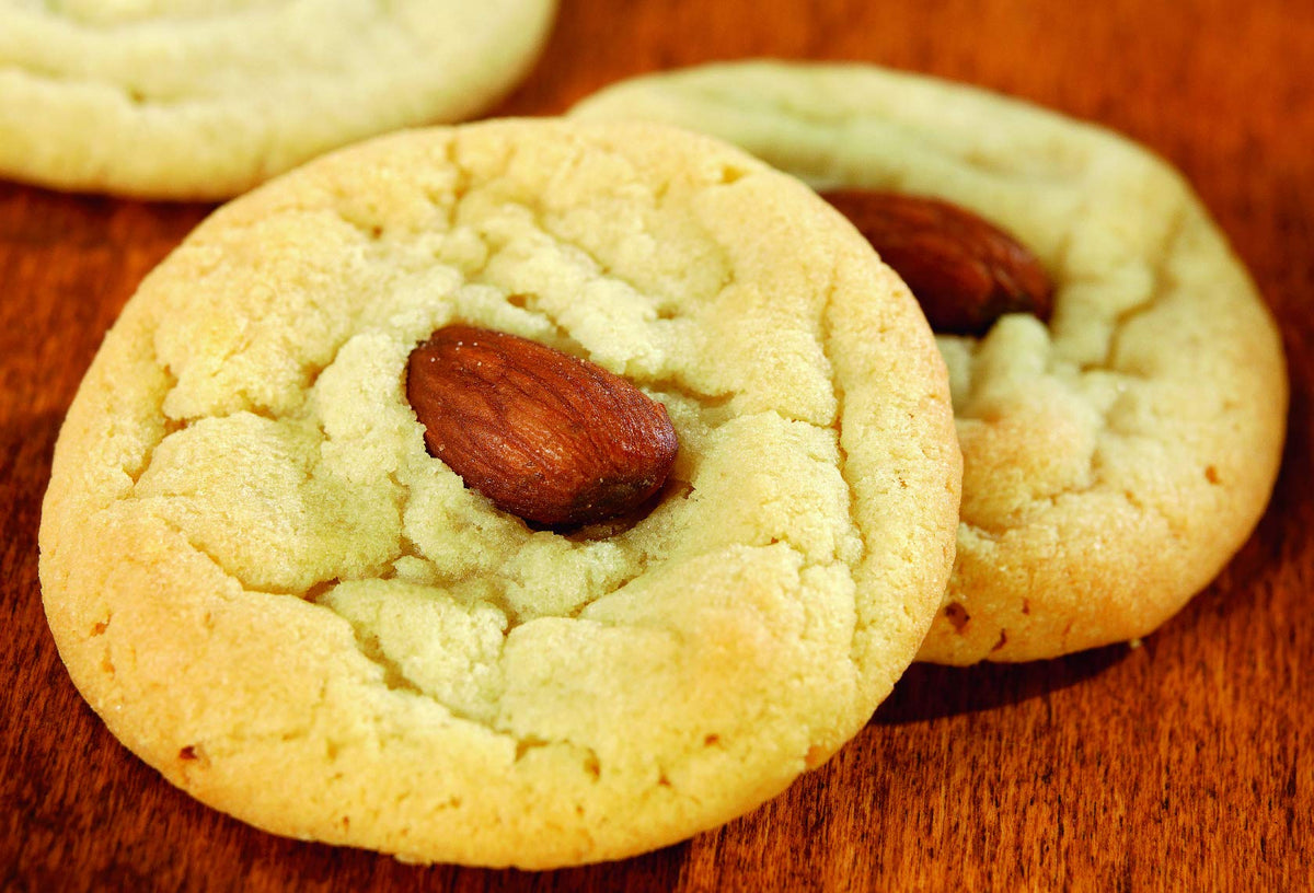 Watkins Almond Extract baking setup — enhances cookies, cakes and frostings.