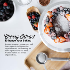 Watkins Cherry Extract being poured, suggesting easy flavoring for desserts and beverages