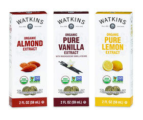 Watkins vanilla extract being poured into batter for desserts.