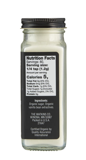Watkins Vanilla Powder dispensing spoon close-up for precise flavoring.