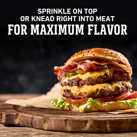 Grilling burgers with Weber Gourmet Burger Seasoning for enhanced aroma.