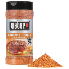Weber Gourmet Burger Seasoning shaker close-up for rich grill flavor.