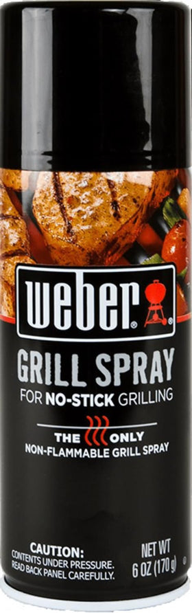 Weber Grill'N Spray being applied on a hot grill for safe use.