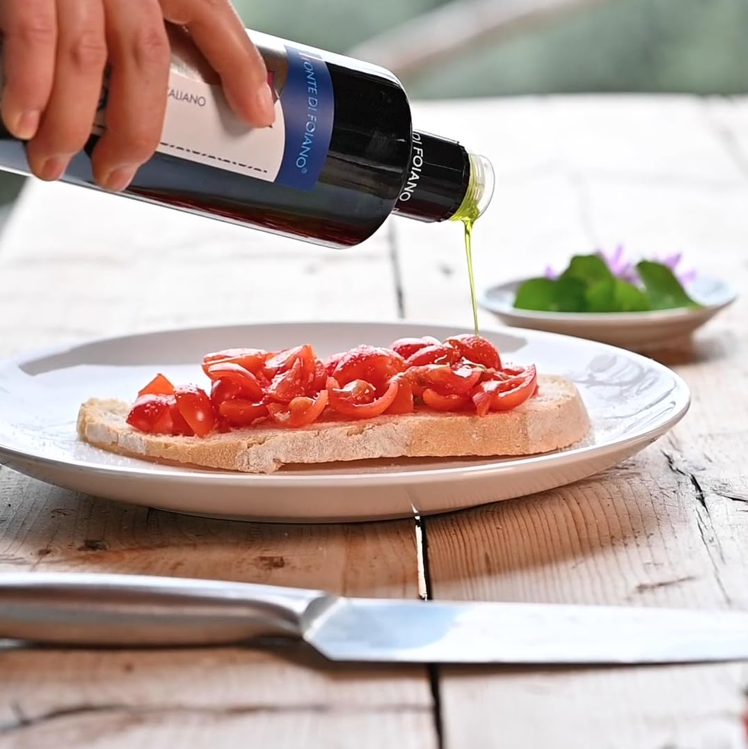 WellEatable Tuscan olive oil on olive branch, authentic freshness