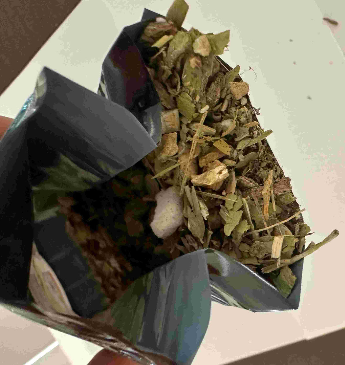 Wellbeing Herbs Small Swedish Bitters glass ready to serve with tea.