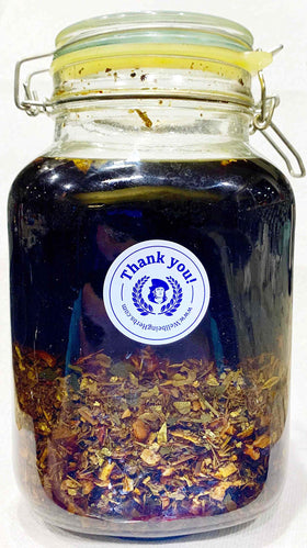Herbal infusion setup with Swedish Bitters, suited for homemade tinctures.