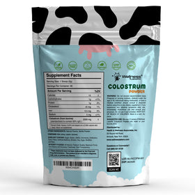 WELLNESS LABSRX Colostrum Vanilla Powder scoop ready for smoothie