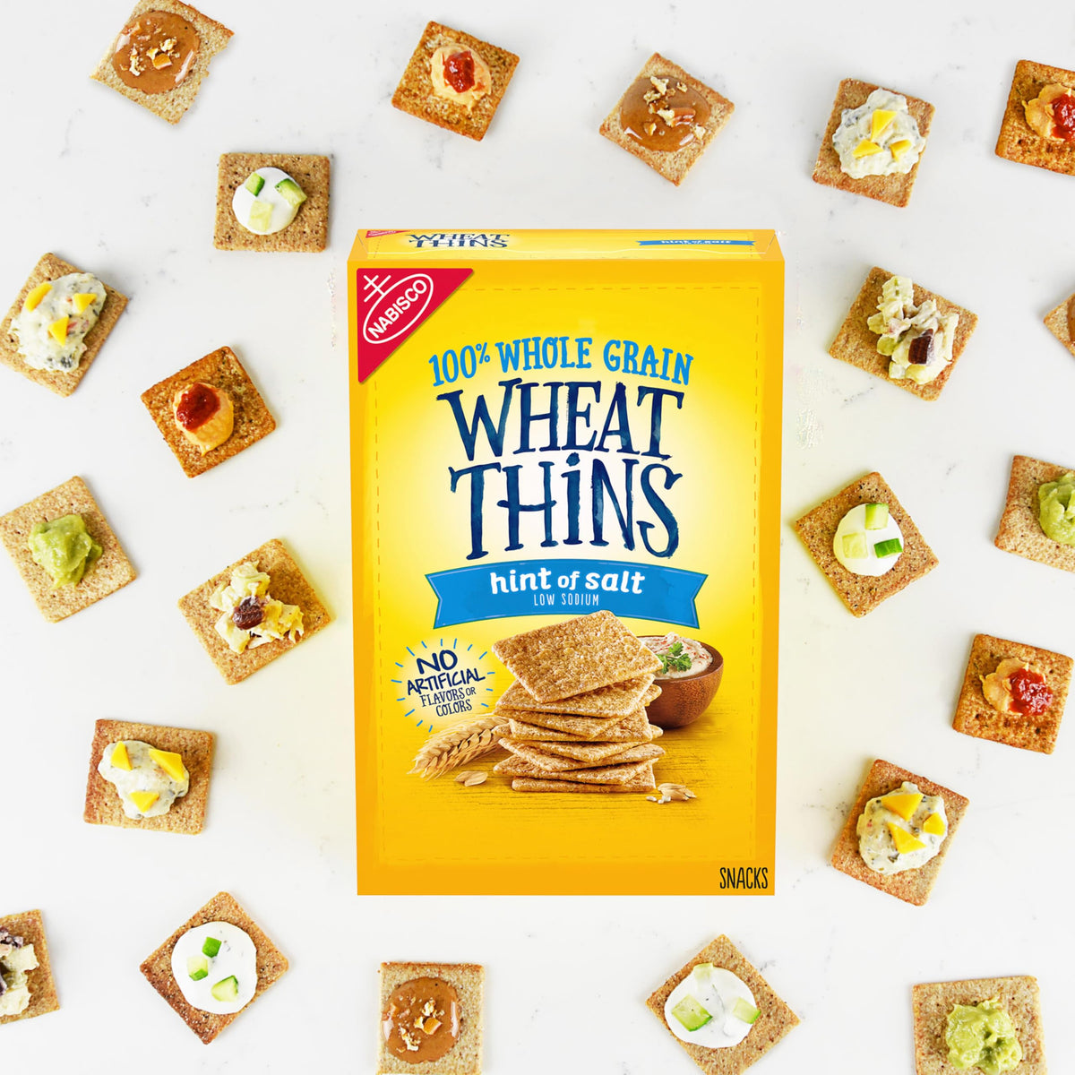 Wheat Thins Hint of Salt crackers on a cheese board for entertaining.