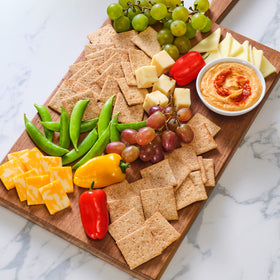 Wheat Thins Reduced Fat crackers arranged on a cheese board for entertaining.
