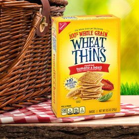 Wheat Thins Sundried Tomato & Basil as party snacks on a tray setup.