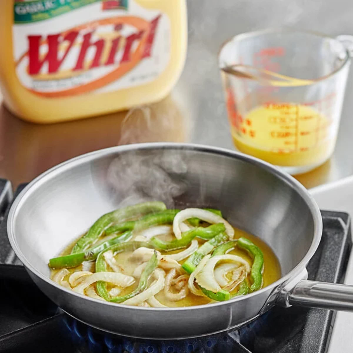 Whirl Garlic Butter Flavor Oil brushed on bread, elevating garlic butter notes