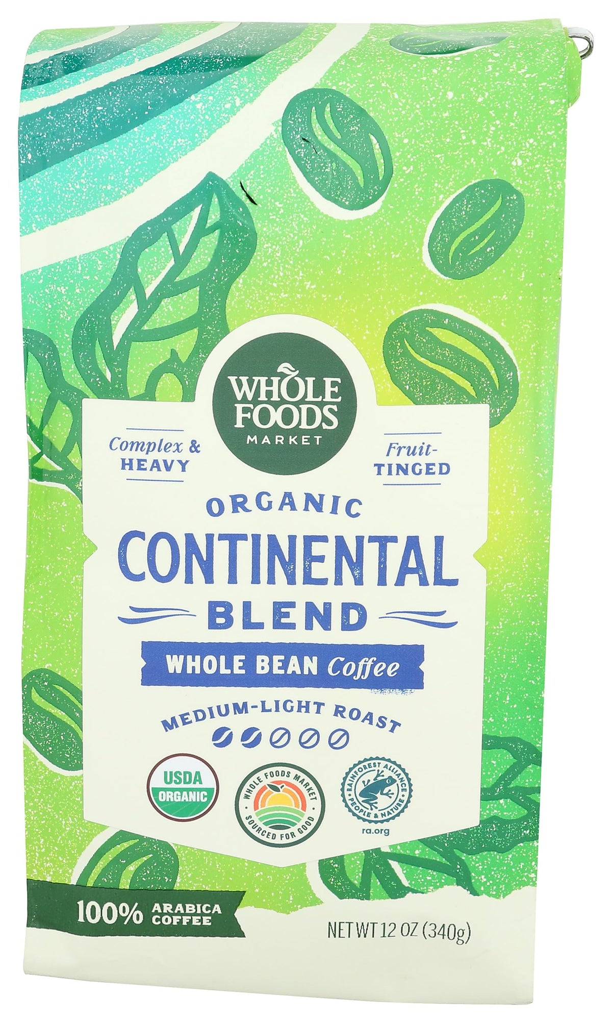 Whole Foods Market Continental Blend coffee beans with a rich, fruit-tinged aroma.