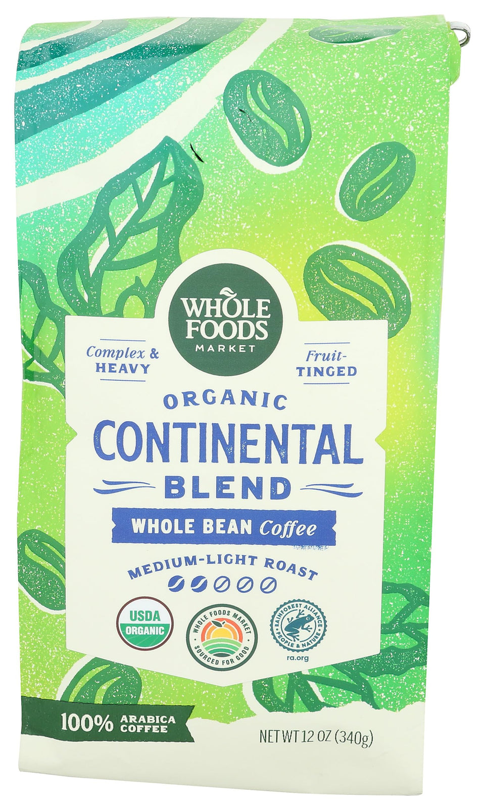 Whole Foods Market Continental Blend coffee beans with a rich, fruit-tinged aroma.
