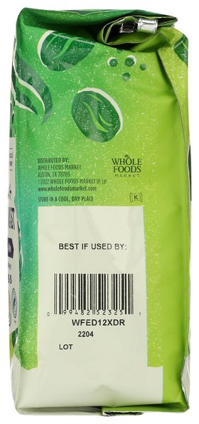 Mug with Whole Foods Market Extra Dark Roast coffee beside bag