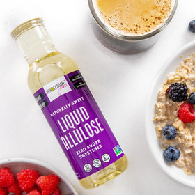 Wholesome Yum Liquid Allulose Sweetener added to a cocktail for light sweetness