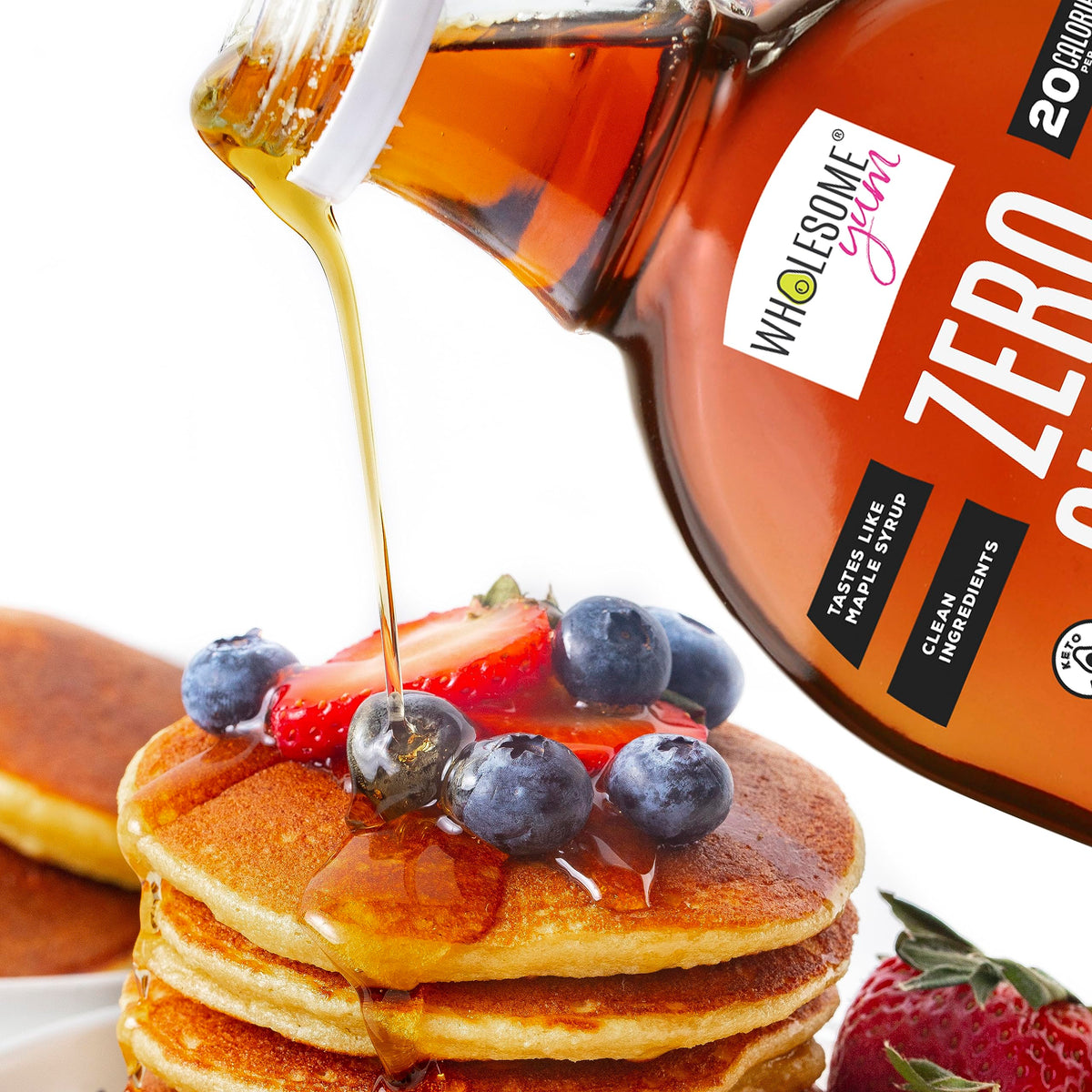 Glass bottle on a breakfast table with syrup drizzle on yogurt and oats.