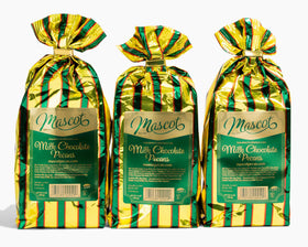 WIAONE Mascot milk chocolate covered pecans on a plate, perfect for gifting.