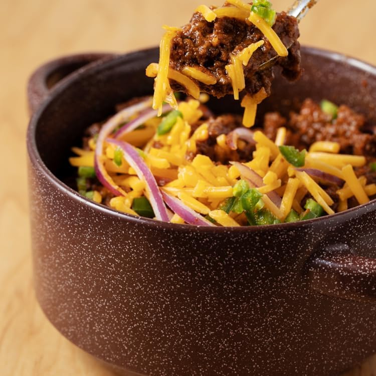 Wick Fowler's 2-Alarm chili simmering fills the kitchen with rich aroma.