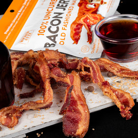 Wicked Cutz Smoked BBQ bacon jerky close-up, bold smoky flavor.