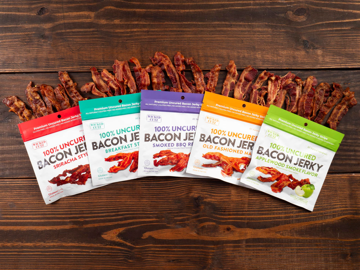 Office desk setup with Wicked Cutz Sriracha Bacon Jerky as a snack