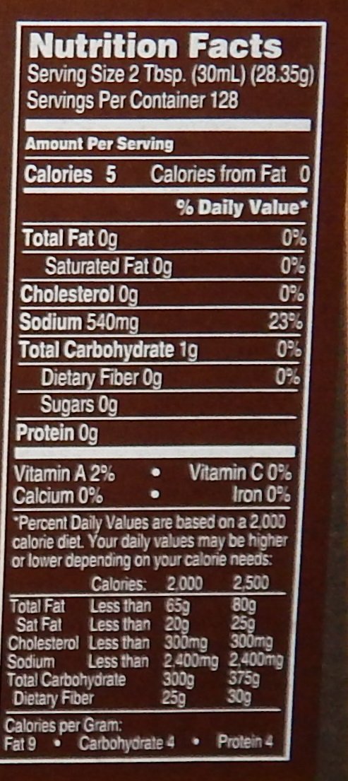 Wicker's Marinade Original 1 Gal bottle pour view for quick marinating and basting.