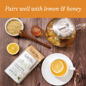 Wild Bliss Elderflower Tea served with lemon and honey for a comforting, caffeine-free treat