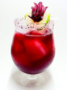 Wild Hibiscus Flowers in Syrup in champagne flute; color and aroma in bubbly drinks.