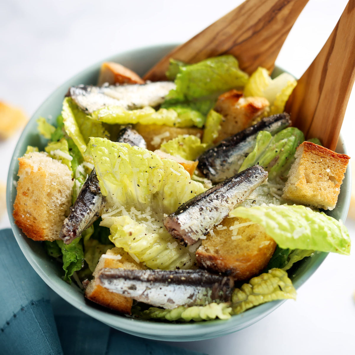 Wild Planet anchovies fillets close-up reveal delicate texture and small, meaty pieces.