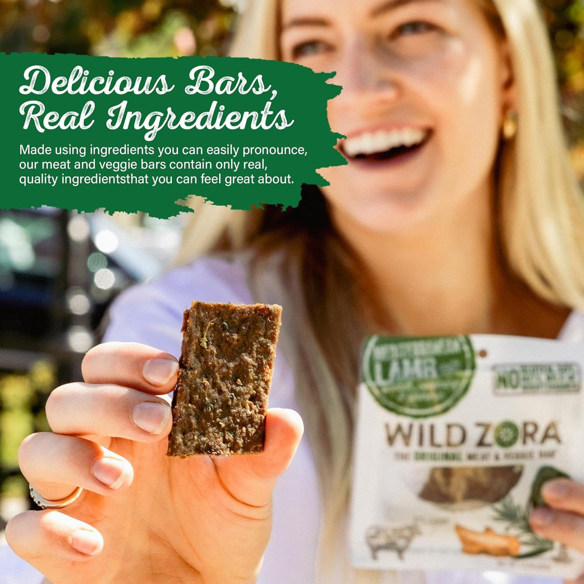 Wild Zora grass-fed lamb bars close-up texture highlighting natural fats and rosemary.
