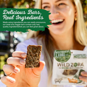 Wild Zora grass-fed lamb bars close-up texture highlighting natural fats and rosemary.