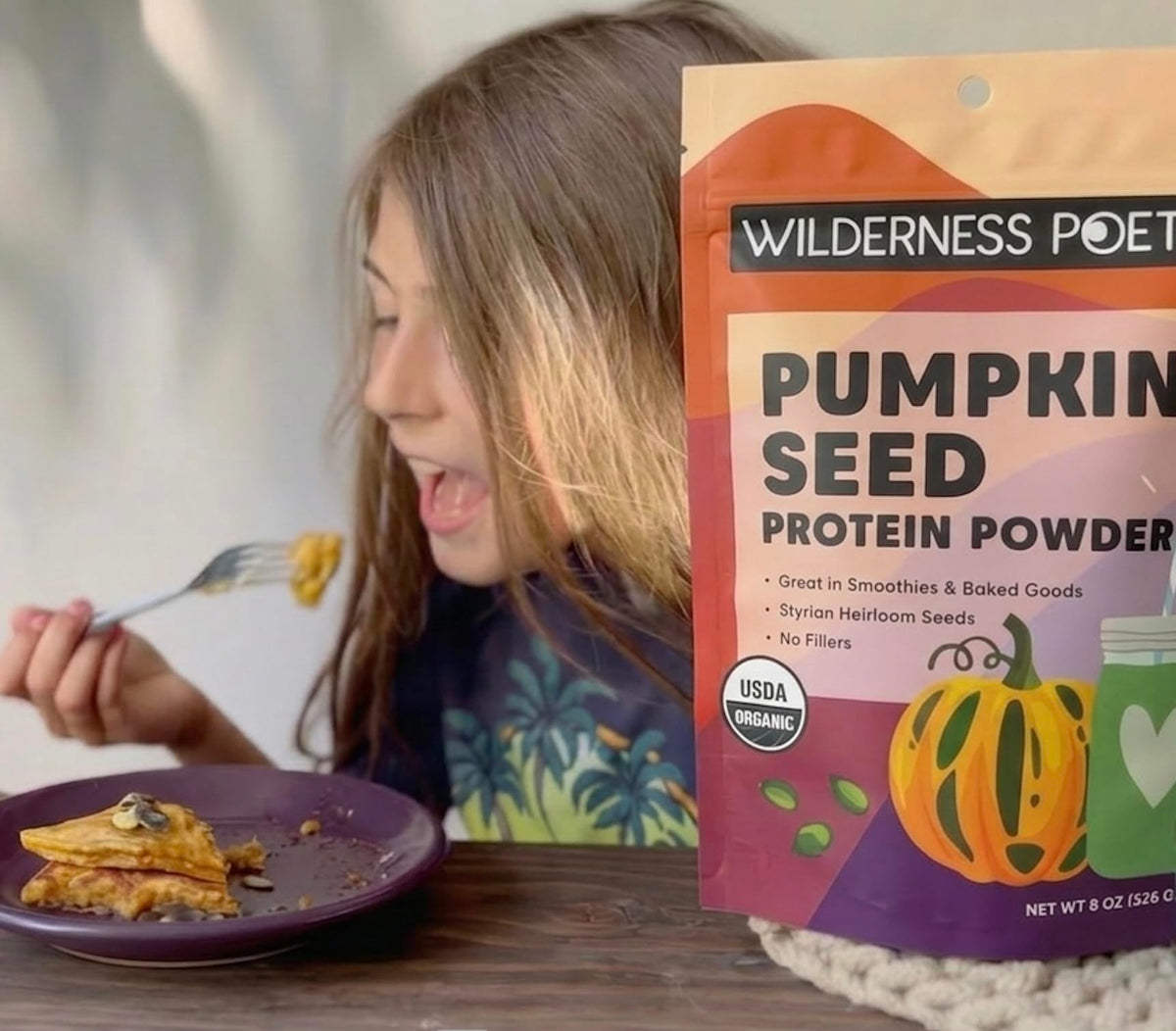 Open package of Wilderness Poets pumpkin seed protein powder ready for baking